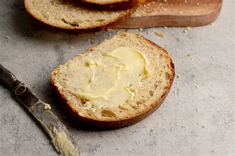 Bread and Butter. Closeup Sourdough Slice of Homemade White Loaf Bread with Butter. Stock Photo ...