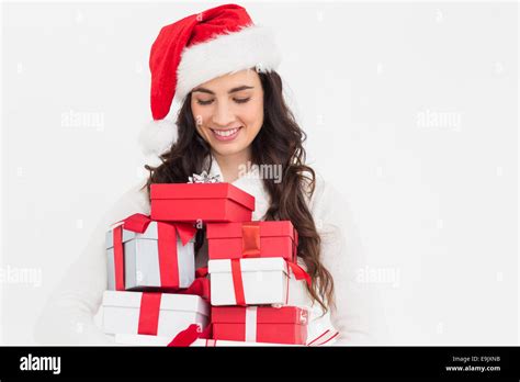 Festive Brunette Holding Pile Of Gifts Stock Photo Alamy