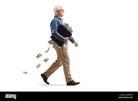 Full Length Profile Shot Of A Mature Man Walking With A Briefcase Full