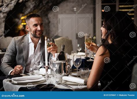 Couple Celebrating In Restaurant Stock Image Image Of Girlfriend