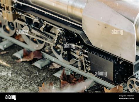 Old steam train wheel mechanism on a railway Stock Photo - Alamy