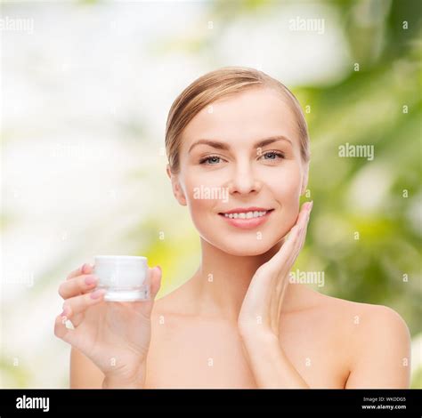 Cosmetics Health And Beauty Concept Beautiful Woman Applying Cream