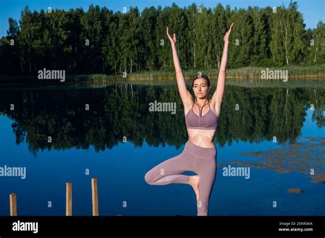 Girl Doing Yoga Tree Pose In Nature Girl Yoga Pose Sports Outdoors