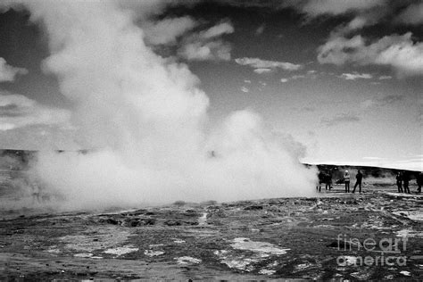 Tourists Stand Around Watching The Strokkur Geyser To Erupt Geysir