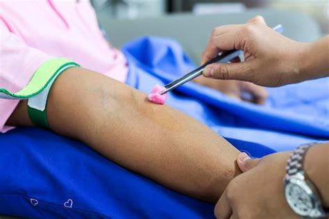 Premium Photo Cropped Image Of Doctor Applying Medicine To Patient