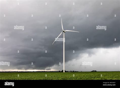 Thunderstorm With Dark Clouds With Wind Turbine Severe Weather Alert