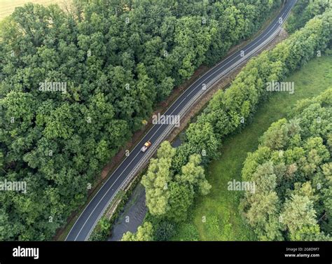 Country road with forest from above Stock Photo - Alamy