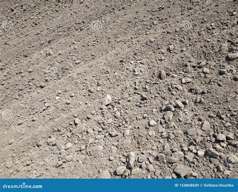 Full Frame View Of Plowed Agriculture Field Naked Light Brown Soil With