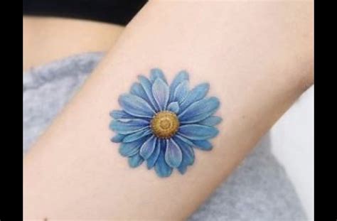 Pin By Mariya Shearin On Tattoos Blue Flower Tattoos Daisy Tattoo