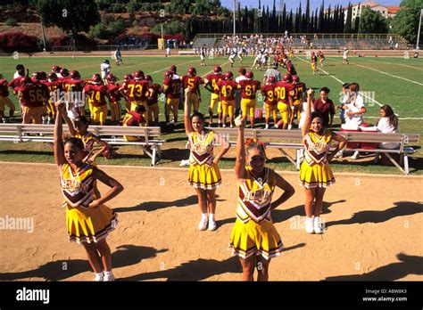 Cheerleaders Leading Cheer For High School Football Game In Los Angeles