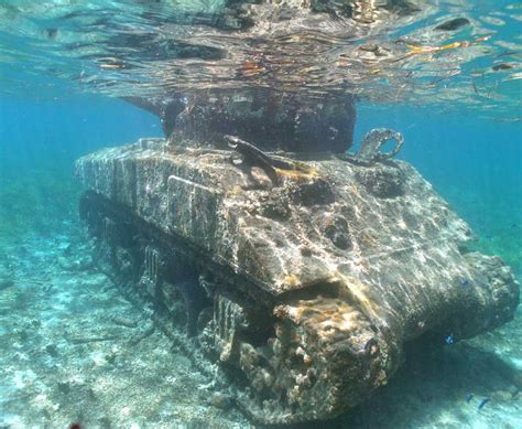 Sherman tank in one of the Saipan landing beaches : wwiipics