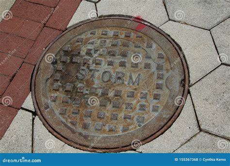 Storm Drain Cover in the Sidewalk Stock Photo - Image of green, environment: 155367368