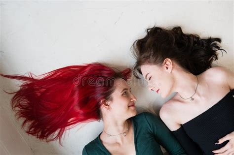Top View Of Two Women Lying Side By Side Lesbian Intimacy Stock Photo