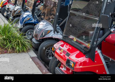 The Villages Florida retirement community with golf carts lined up in ...