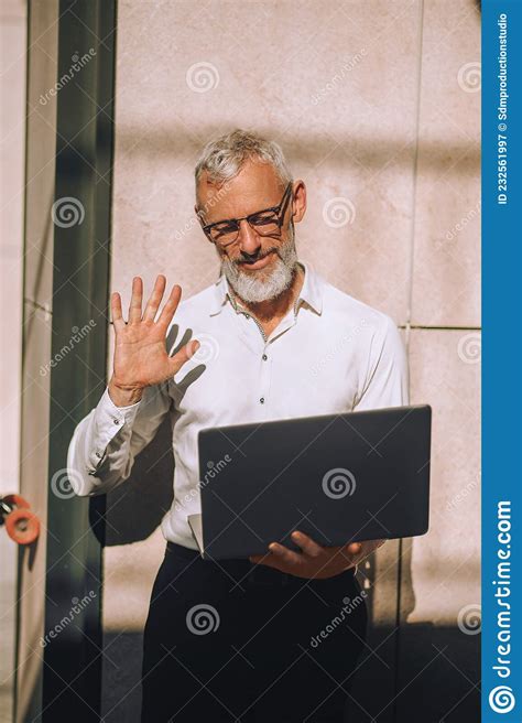 Mature Caucasian Man Communicating With His Contacts On Skype Stock