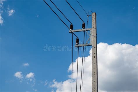 Electricity Concrete Post And High Voltage Wire At Sky Background Stock