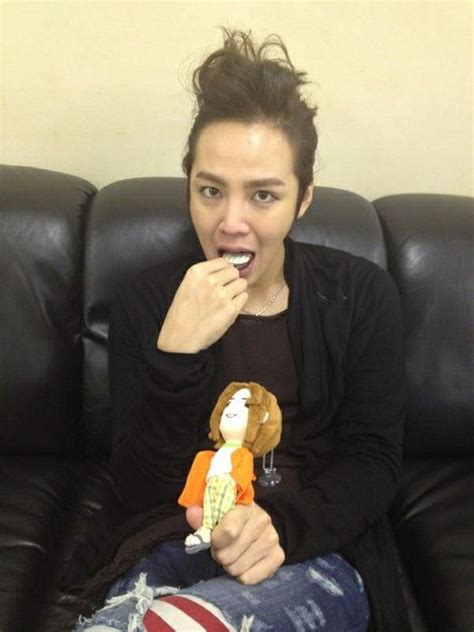 Jang Keun Suk Food In His Mouth And Holding A Doll Wearing Flip