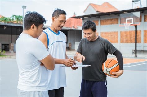 Premium Photo | People standing on basketball court