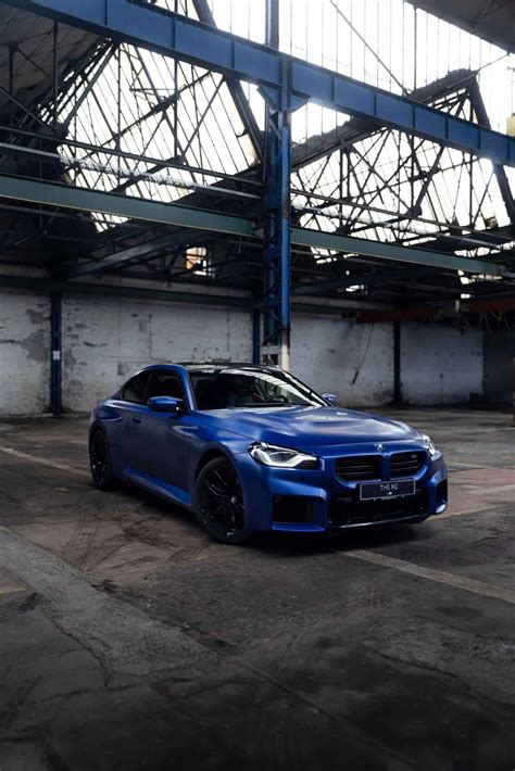 Two Bmw M2 Frozen Portimao Blue G87s Pose For The Camera