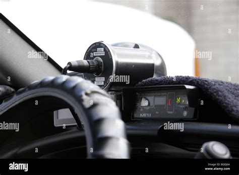 Police Speed Camera Fixed To Dashboard Inside A Police Car Stock Photo