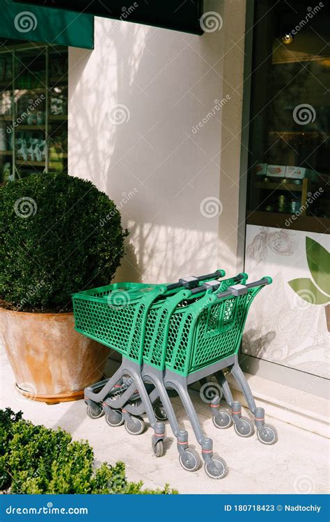 Supermarket Trolleys Filled With Medical Capsules On A Coloured