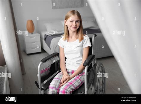 Teenage Girl In Wheelchair Indoors Stock Photo Alamy