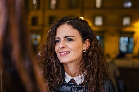 Italian Woman Listening To Friend Talking By Stocksy Contributor