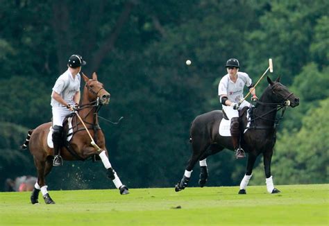 Princes William And Harry Play Polo In The Audi Polo Challenge At Coworth Park In Berkshire On