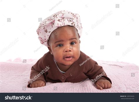 Happy Smiling 3 Month Old Baby African American Girl Crawling On White