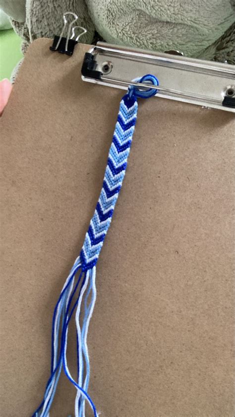 Someone Is Holding A Blue And White Rope On A Clipboard