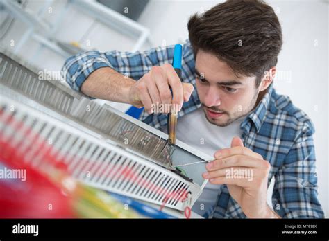 Fixing And Soldering Radiator Stock Photo Alamy