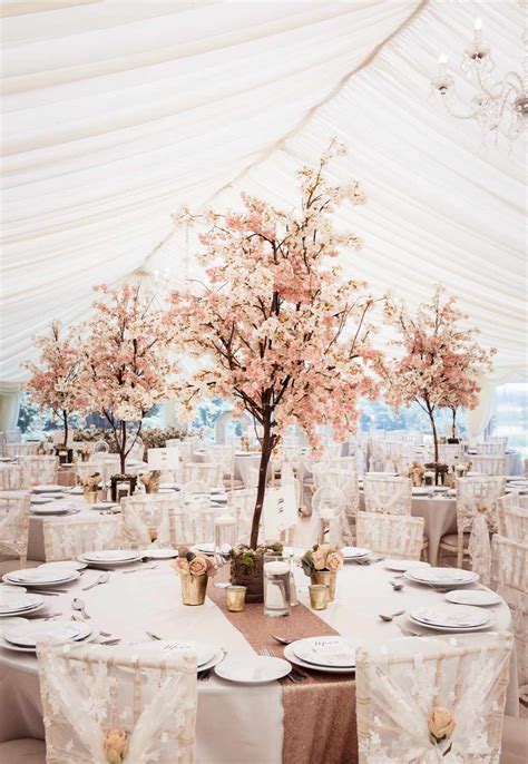 25 Tree Centerpieces to Bring Your Reception to Life