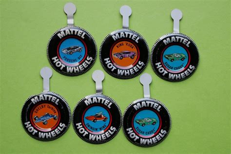 Six Hot Wheels Badges