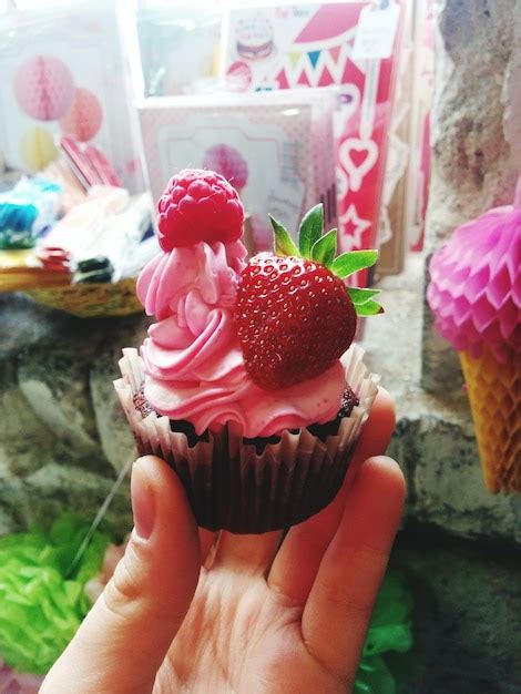 Premium Photo Woman Holding Cupcake