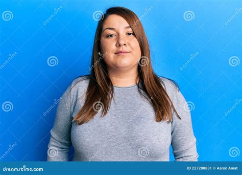 Beautiful Brunette Plus Size Woman Wearing Casual Clothes Relaxed With