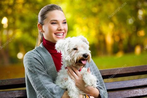 Young girl hugging her dog Stock Photo by ©luckybusiness 60713747