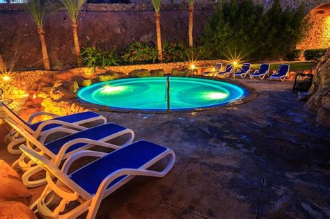 Premium Photo | Evening view for luxury swimming pool in night illumination