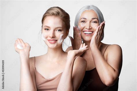 Happy Mother And Daughter Of Different Ages Take Care Of Their Skin