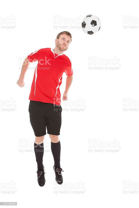 Soccer Player Jumping Over White Background Stock Photo Download