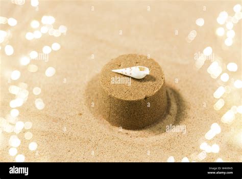 sand shape made by mold with shell on summer beach Stock Photo - Alamy