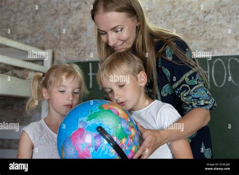 Children Studying Map Hi Res Stock Photography And Images Alamy