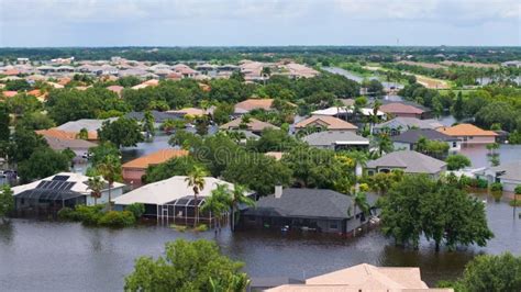 Tropical Rainstorm Flooded Residential Homes In Suburban Community In