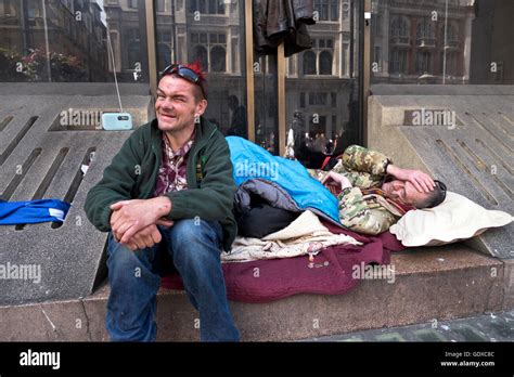 Two Homeless Men Sleeping Rough On Whitehall In Central London Stock