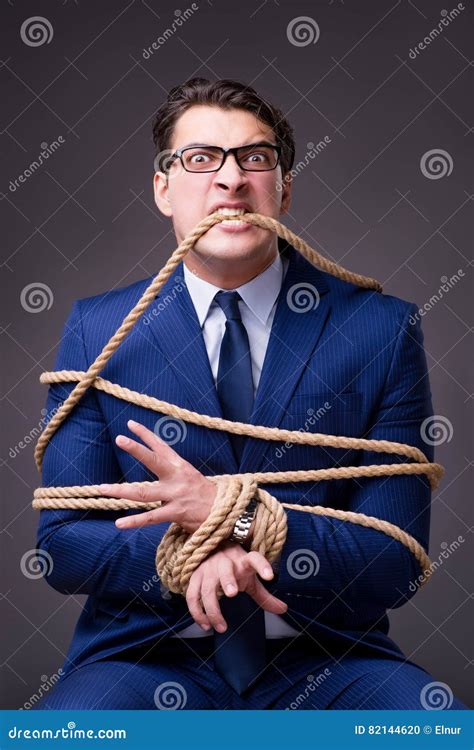 The Businessman Tied Up With Rope Stock Photo Image Of Overdue Boss