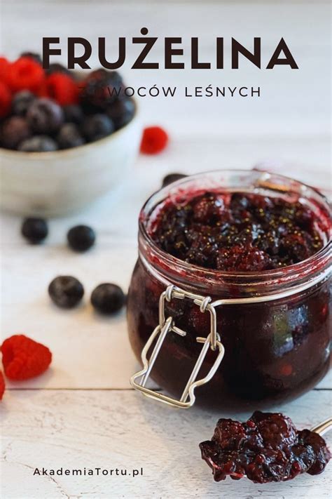 Berries In A Glass Jar With A Spoon Next To It