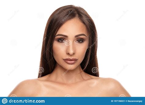 Close Up Portrait Of A Brunette Nude Model Girl With Professional Evening Make Up And Plump Lips