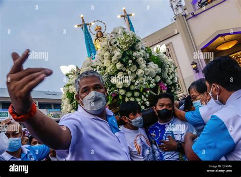 Devotees Carry The Carriage Of Blessed Virgin Mary During The Solemn