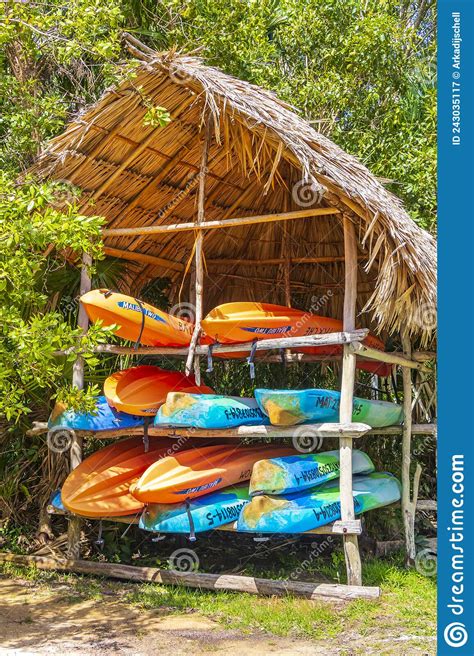 Blue Canoes On The Shore Of The Bow River In Banff National Park Stock