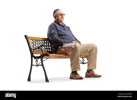 Serious Mature Man Sitting On A Bench And Thinking Isolated On White