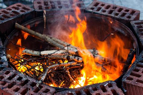 Fire flame in a fire pit stock photo. Image of firewood - 135055962